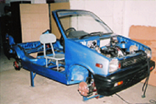 Model No. XS-02:  CUT-SECTION MODEL OF DEMONSTRATION CHASIS   WORKING WITH ELECTIRCALS OF A CARBURATOR VEHICLE